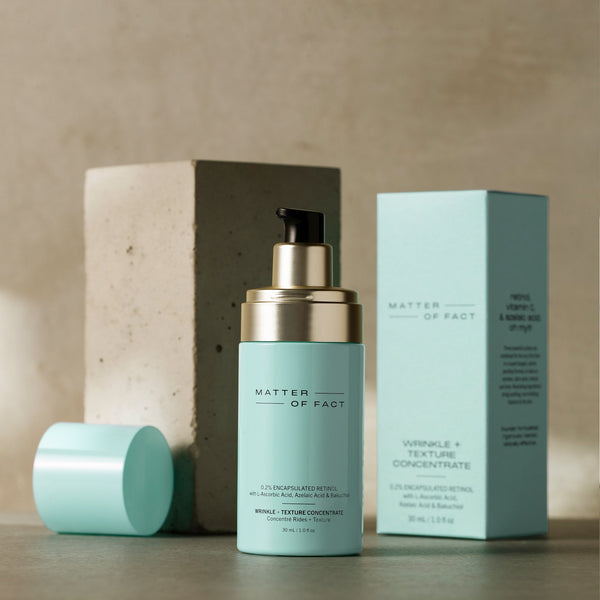 MATTER OF FACE SKINCARE WRINKLE AND TEXTURE CONCENTRATE  product vessel on a beige background with the product packaging and applicator visible